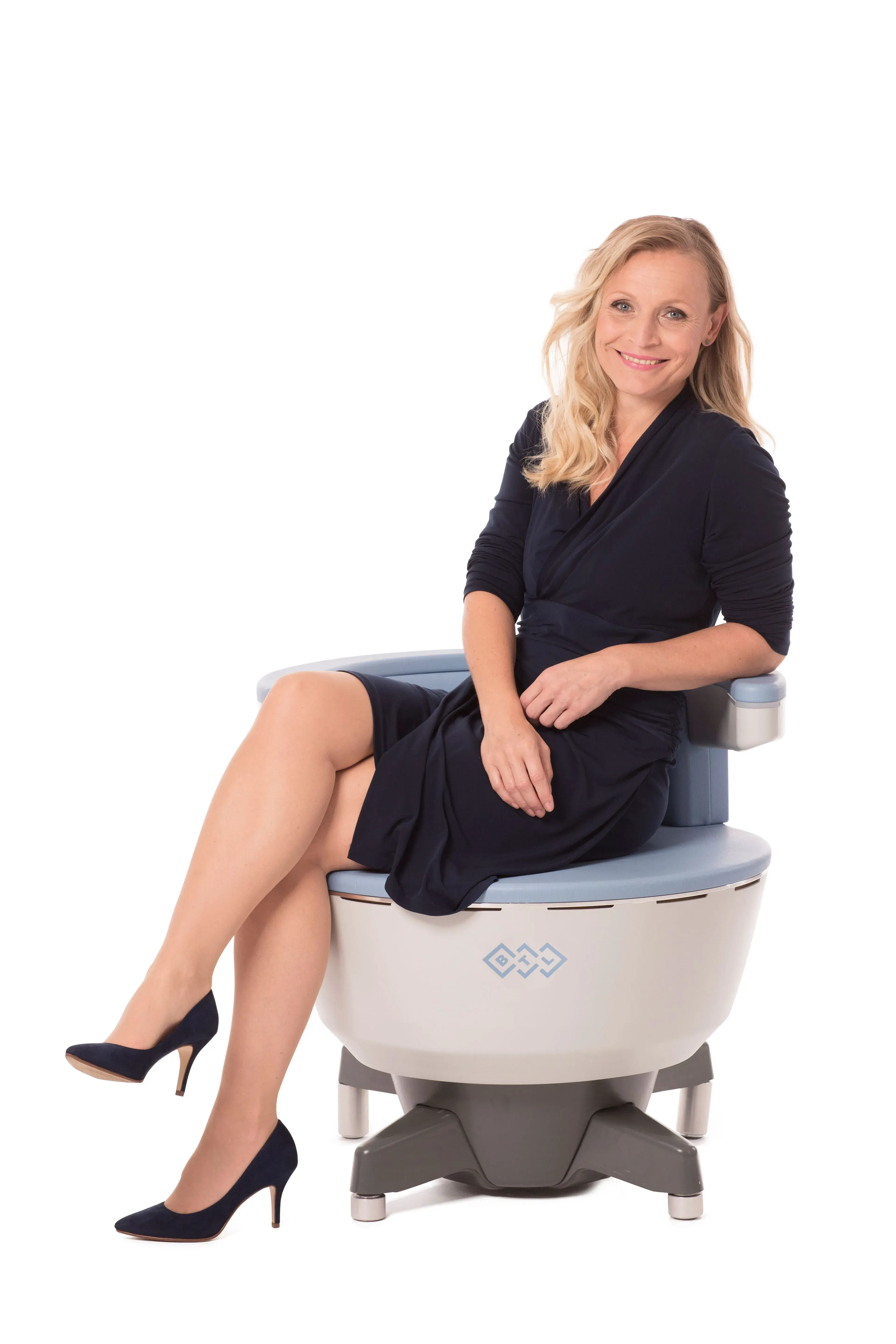 Confident patient portrait after Emsella pelvic floor therapy at Heritage Wellness Crescent Springs