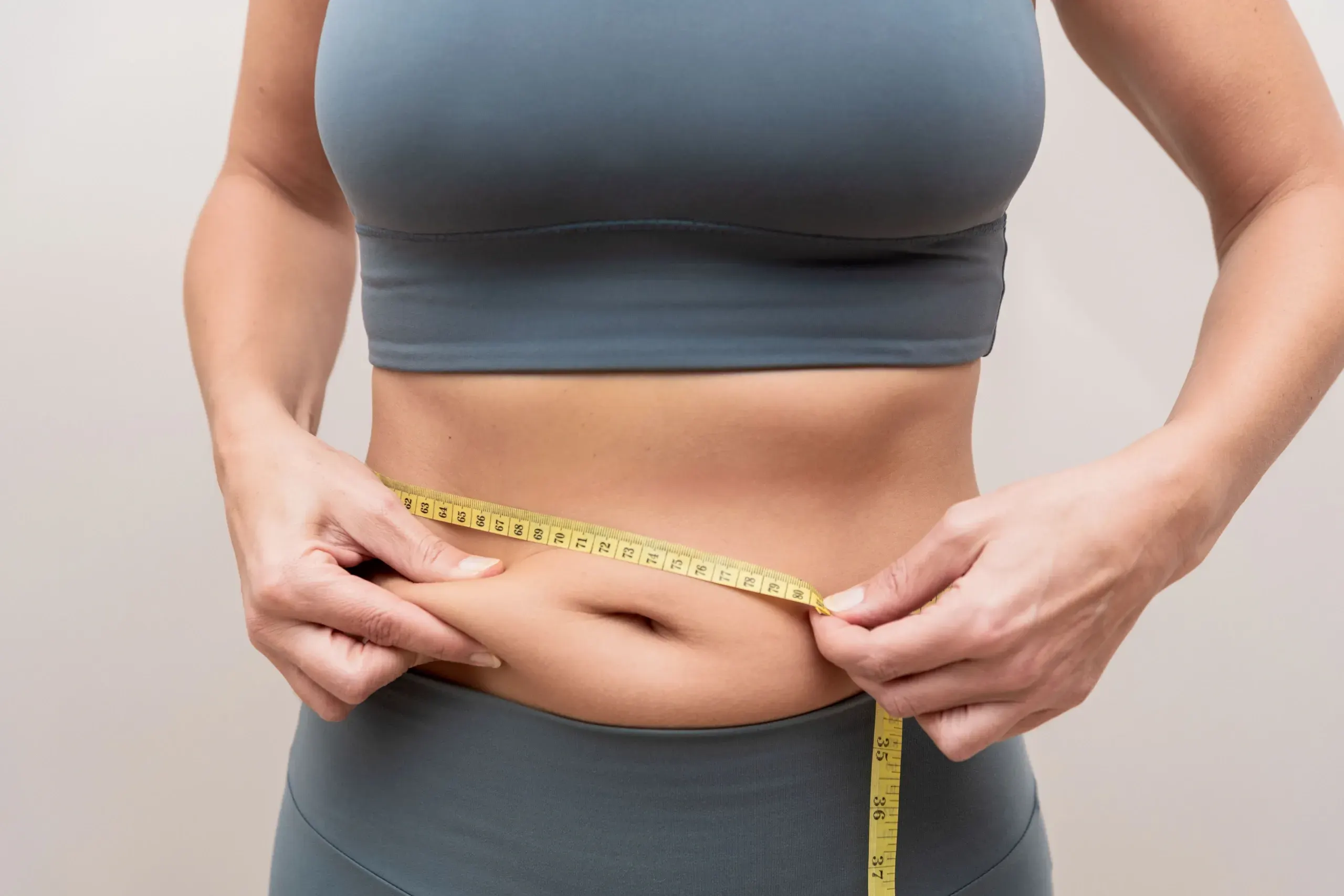 Person addressing stubborn fat concerns at Heritage Wellness & Med Spa Crescent Springs